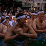 Dozens of worshipers braved the plunge into icy waters at the shrine, in Tokyo, on Sunday. Louise Delmotte/AP
